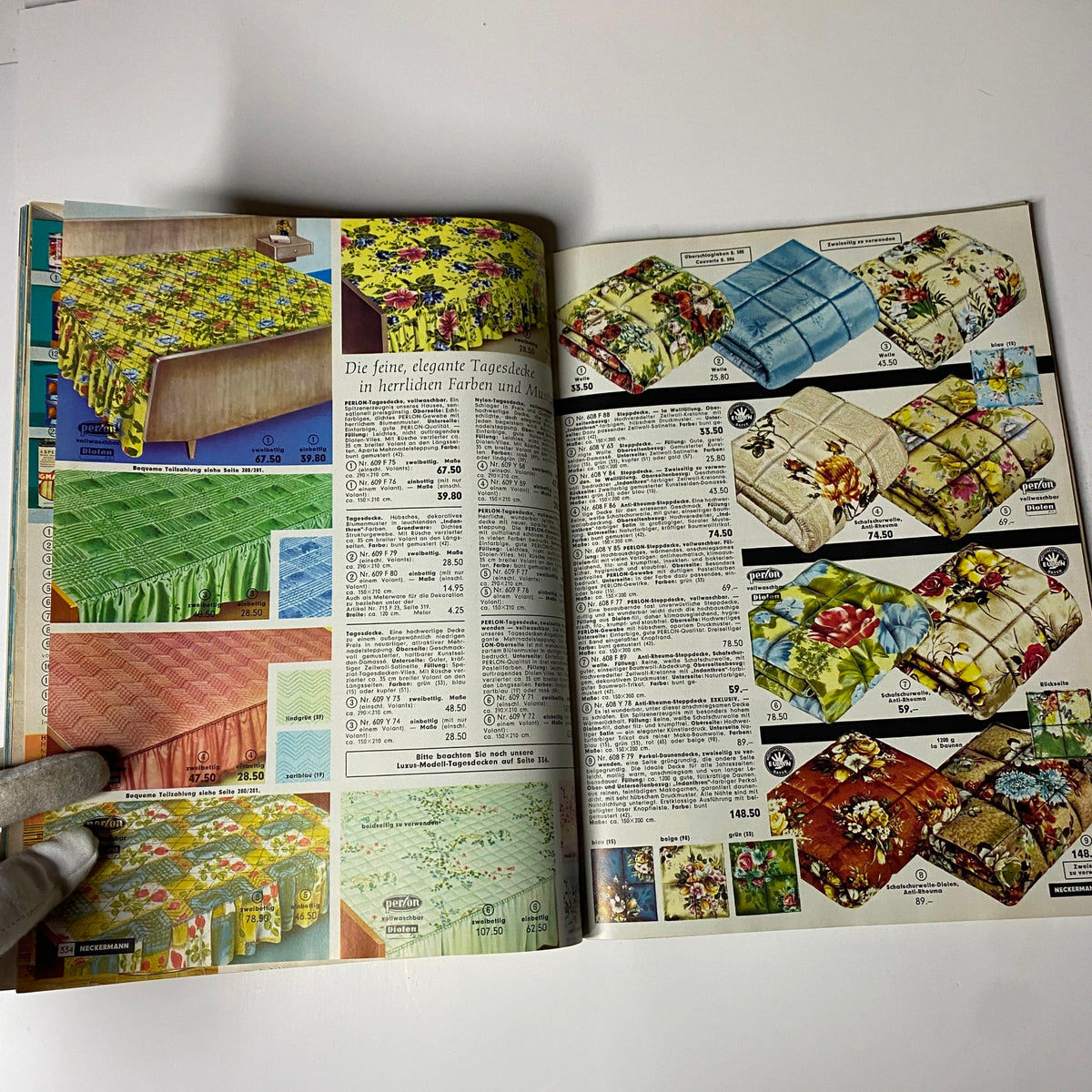 1965 Neckermann Summer Catalog highlighting elegant table linens and bed covers in various colors and floral designs, reflecting the home decor trends of the era.