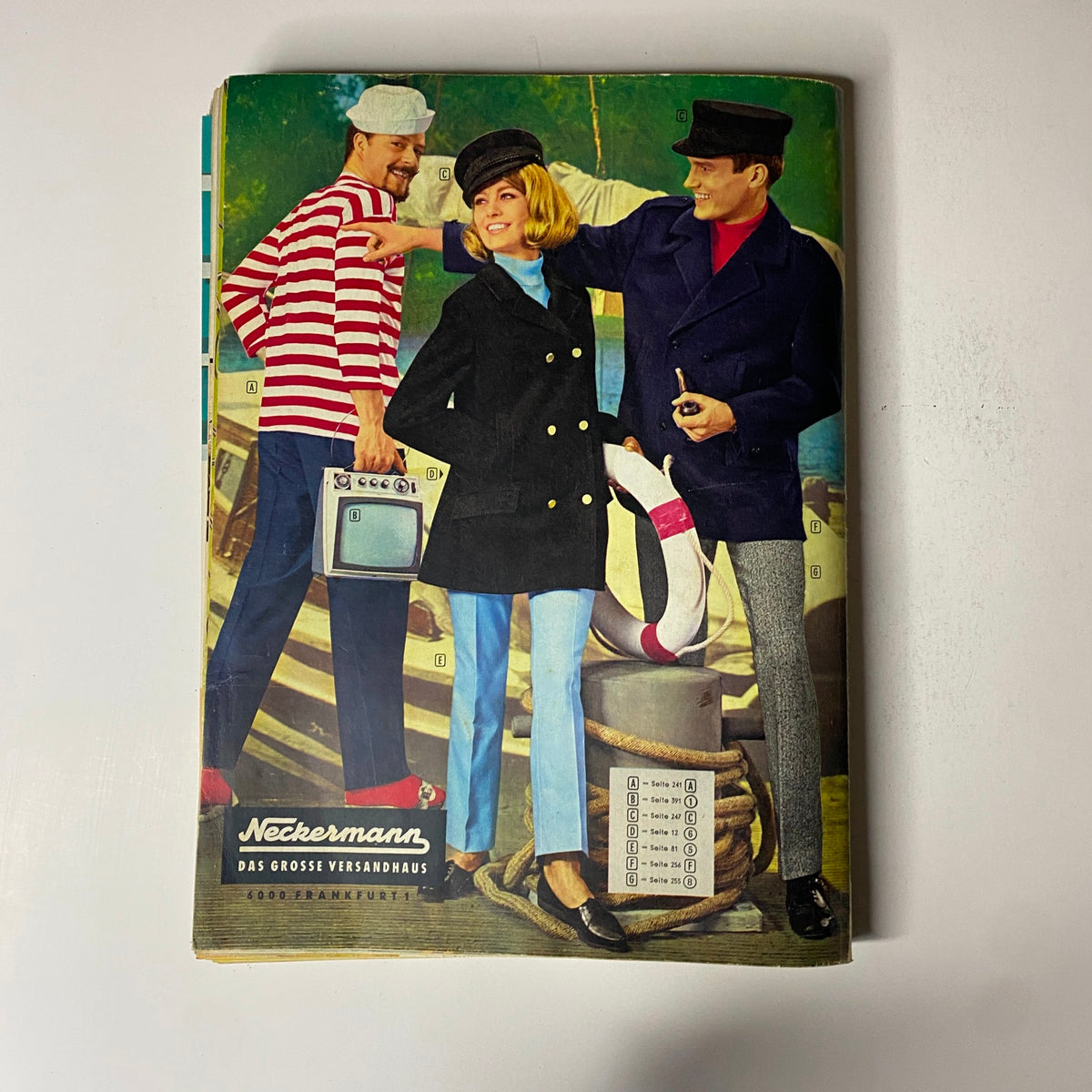 Cover of the 1965 Neckermann Summer Catalog showing stylish models in vintage clothing, embodying 1960s fashion trends.
