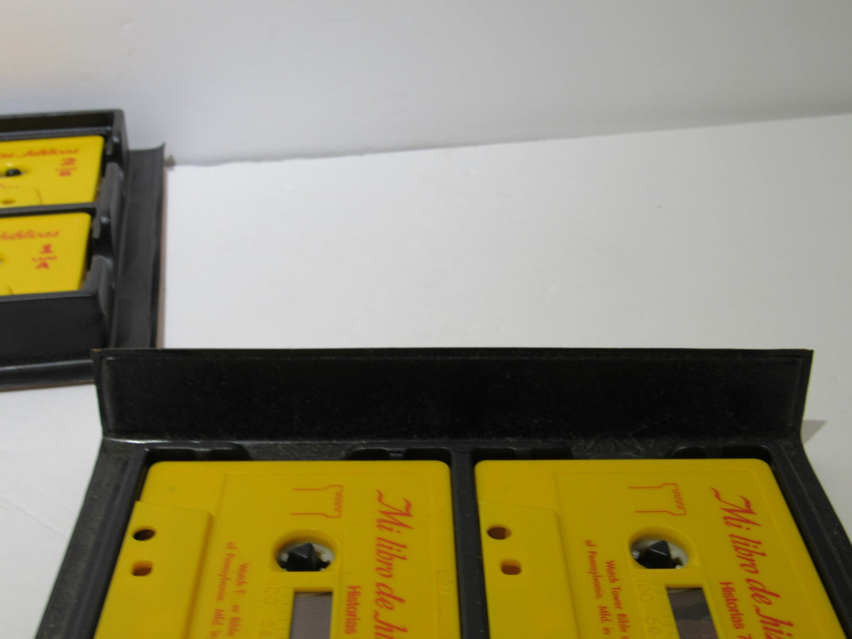 1970s Mi Libro de Historias Biblicas My Book of Bible Stories cassettes in excellent condition, featuring bright yellow packaging, showcasing vintage audio cassettes in a protective case.