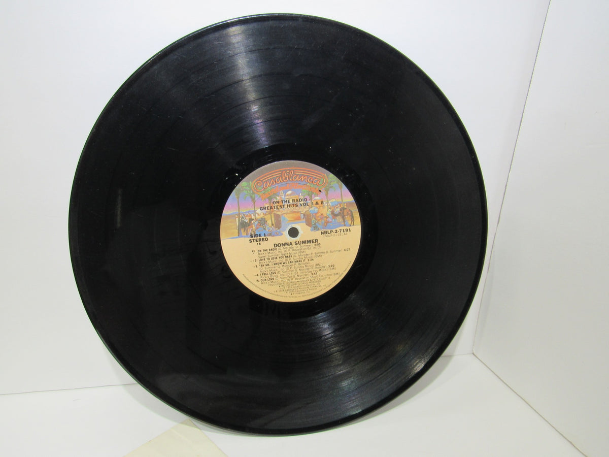 Close-up view of Donna Summer: Greatest Hits on the Radio LP vinyl record, highlighting the label details and glossy finish, showcased for collectors.