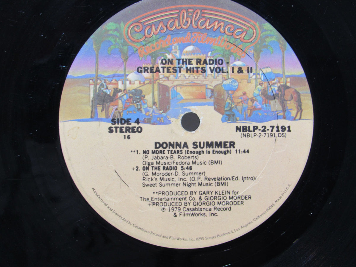 Detailed image of 'Donna Summer: Greatest Hits on the Radio LP NBLP 27191' vinyl label featuring song titles and production credits.