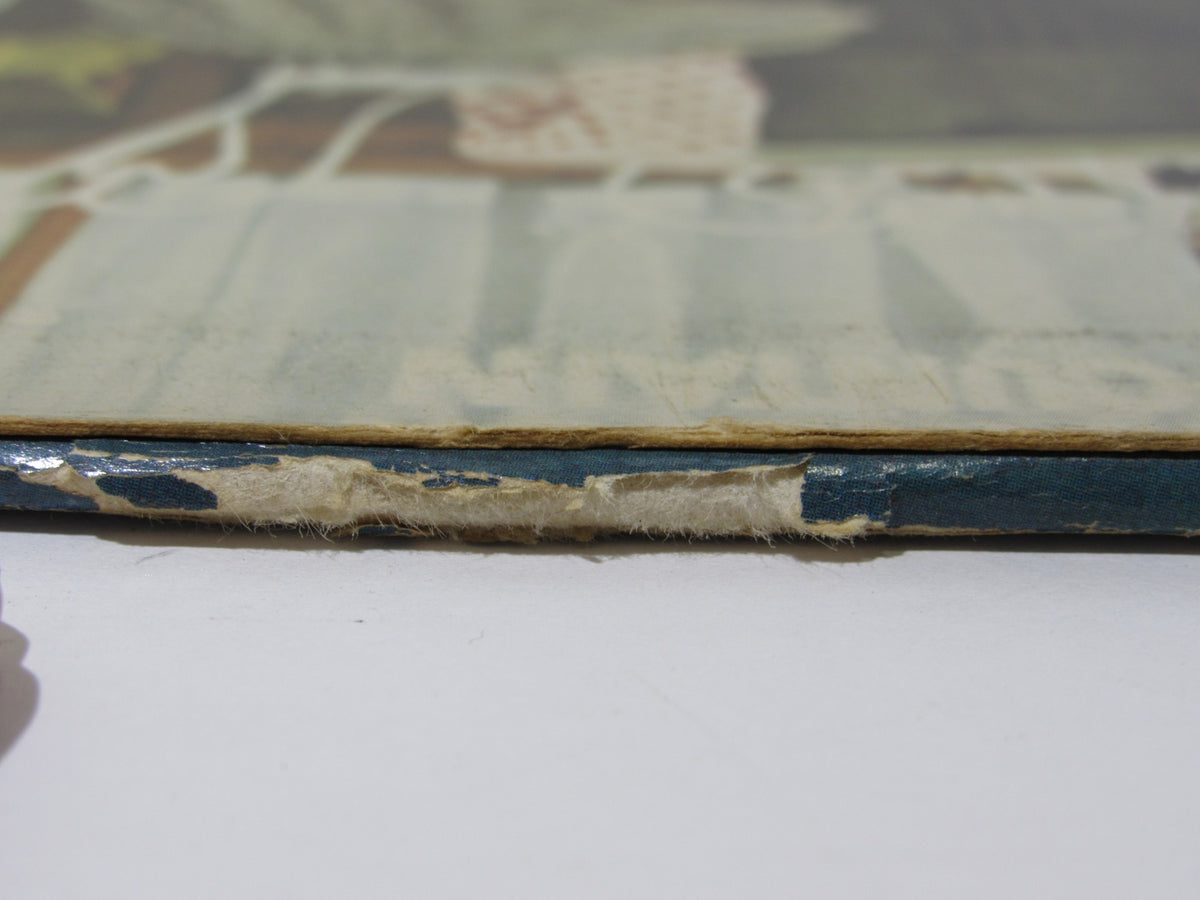 Side view of the cover of 'Donna Summer: Greatest Hits on the Radio LP NBLP 27191' showing edge wear and damage.