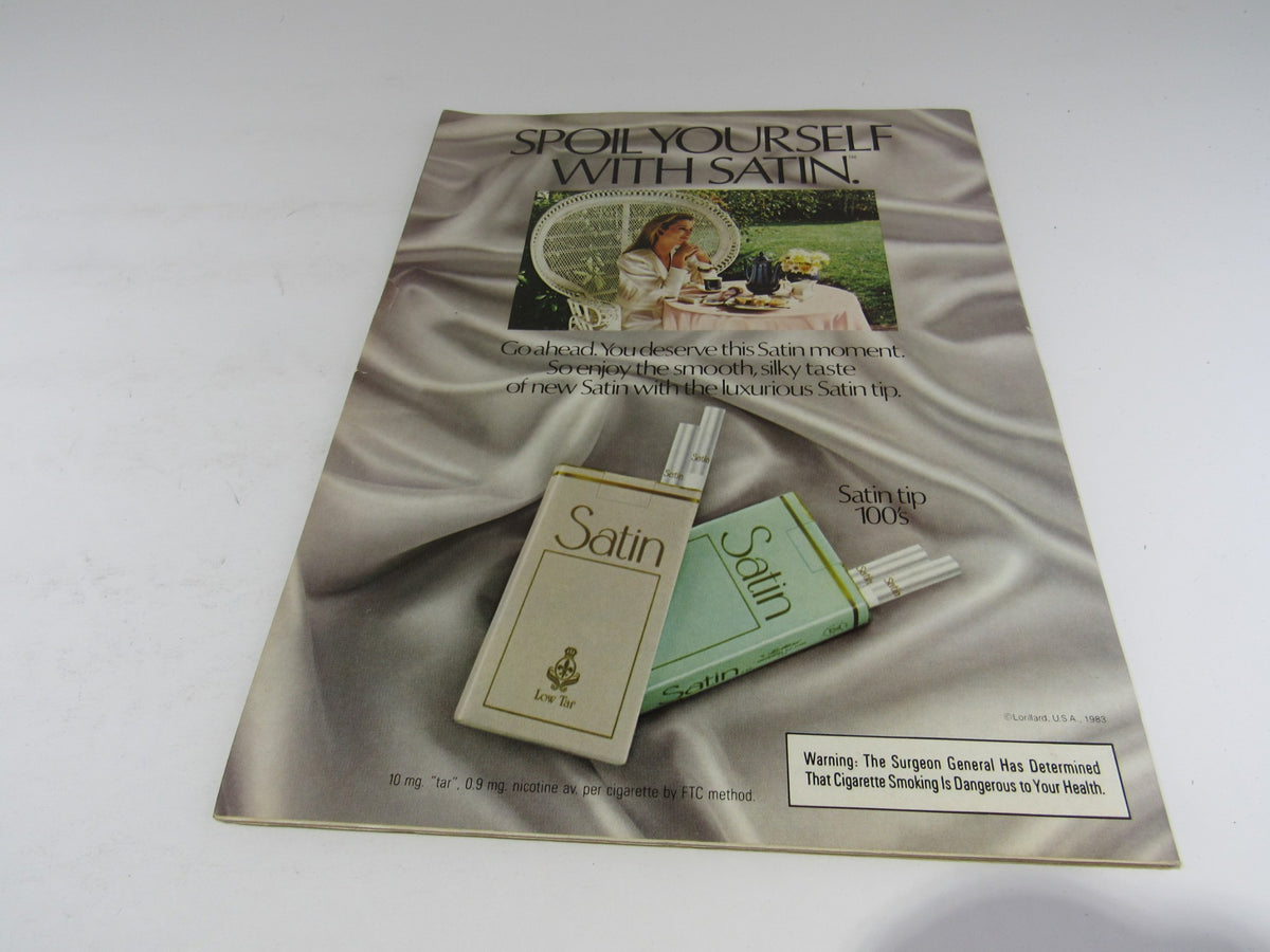 Vintage advertisement for Satin cigarettes from 1983, emphasizing a luxurious lifestyle and smooth smoking experience.