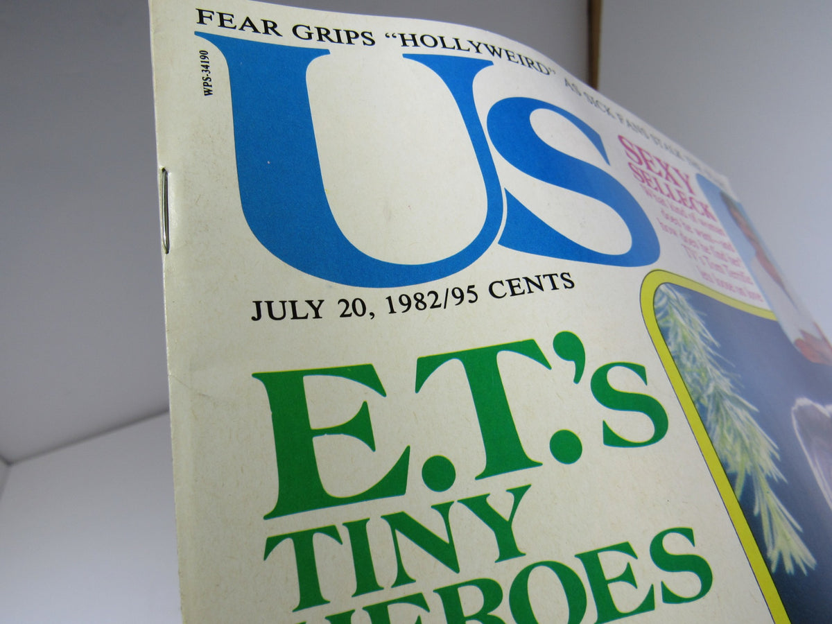 Close-up view of the cover of VTG US Magazine from July 20, 1982, displaying the large bold title 'E.T.'s Tiny Heroes' and featuring Tom Selleck, showcasing its vintage appeal.