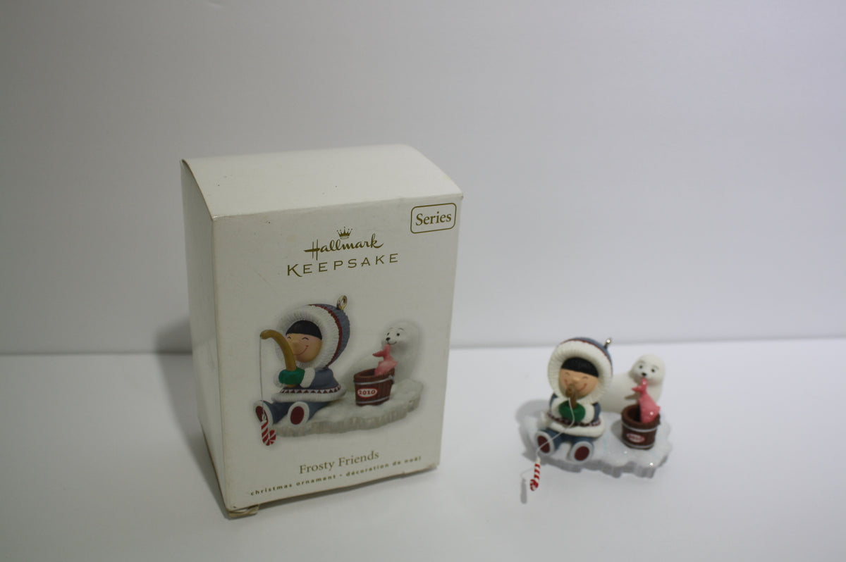 2010 Hallmark Keepsake Series Frosty Friends Fishing figurine with a boy and seal, in original box.
