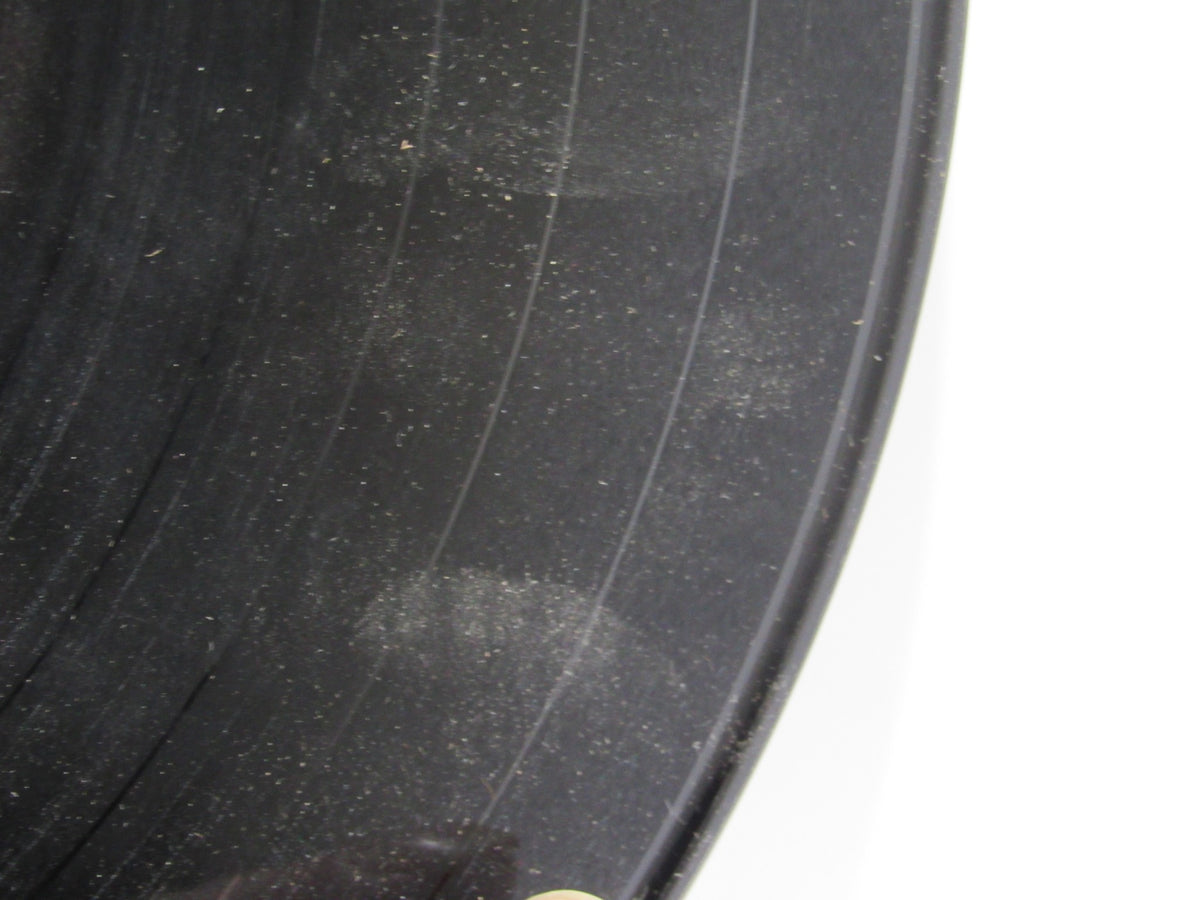 Close-up shot of The Beatles Help! OMPS/OST Capitol Gatefold Stereo LP SMAS 2386 showing surface scratches on the vinyl record.