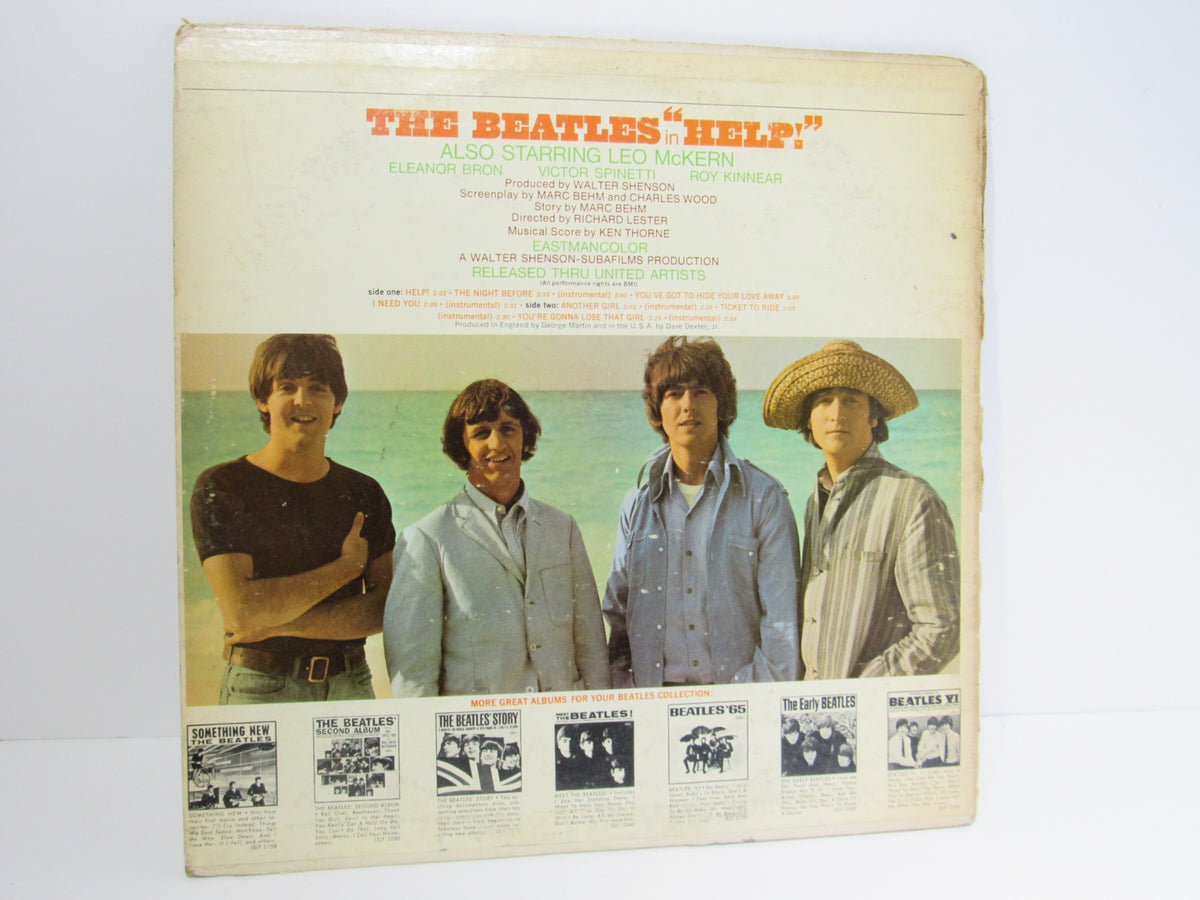 Back cover of The Beatles ‎– Help! OMPS/OST LP featuring promotional images and credits, depicting the iconic band.