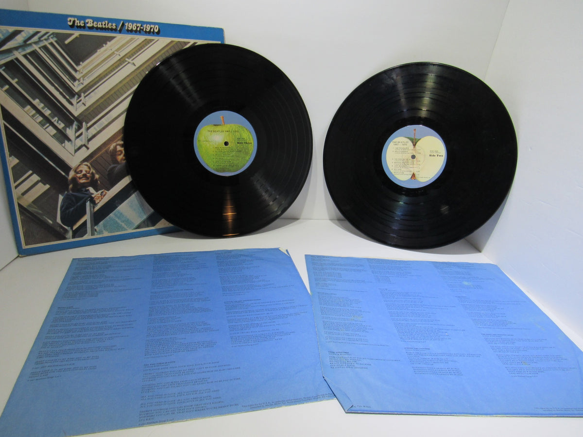 The Beatles 1967-1970 Gatefold Sleeve featuring two vinyl records and blue inner sleeves.