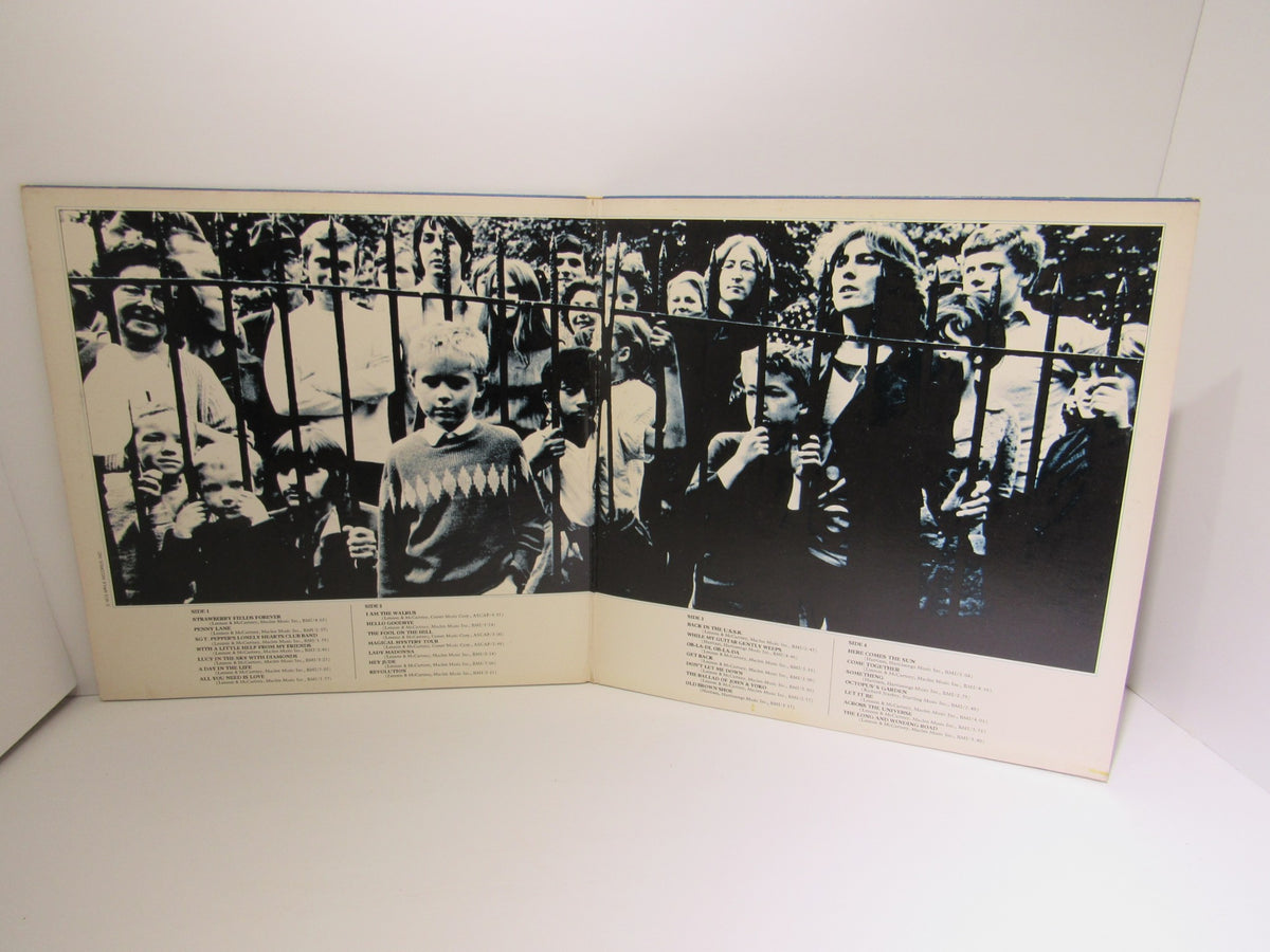 Inside view of The Beatles 1967-1970 Gatefold Sleeve 2X LP SKBO 3404, showcasing a historic photo layout with song lyrics.