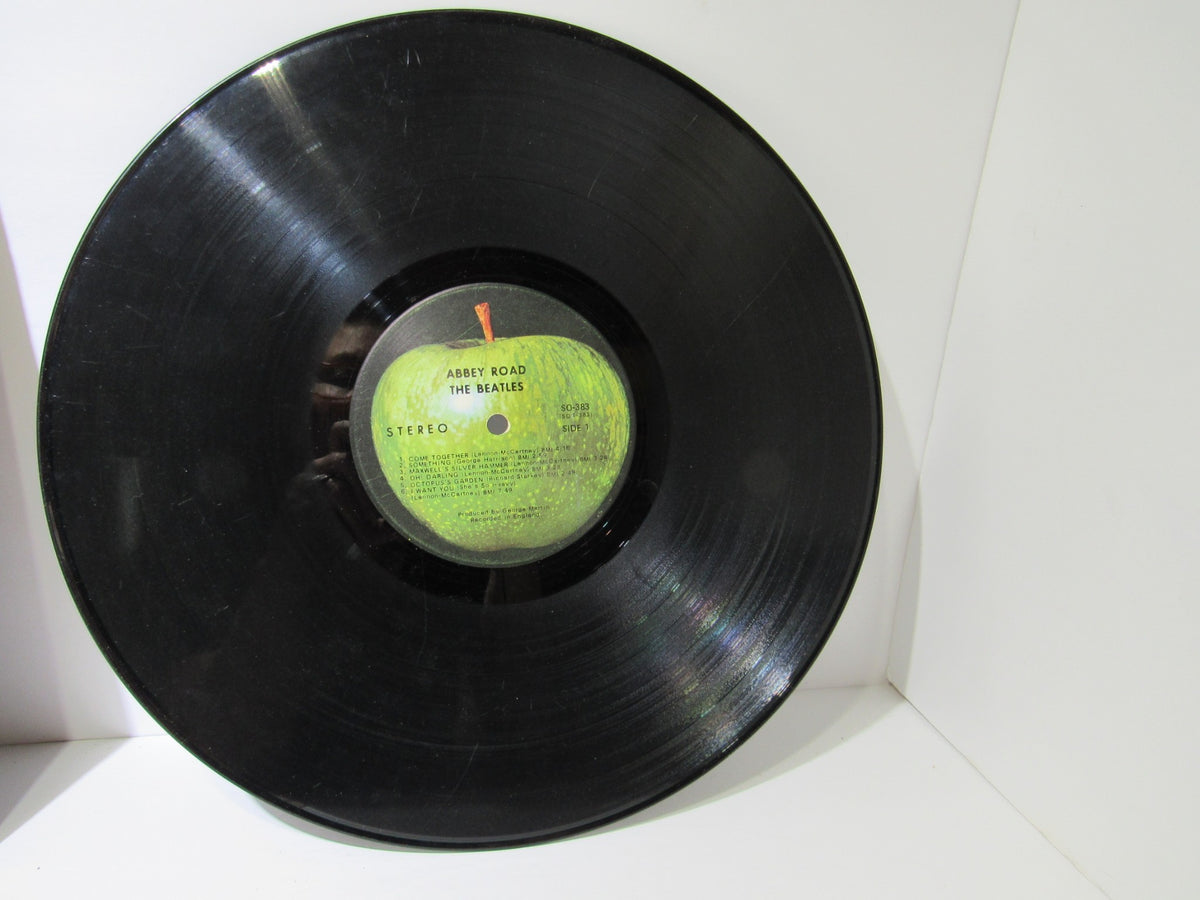 Close-up of The Beatles: Abbey Road US Press Apple Records LP SO 383 vinyl record showcasing the label.