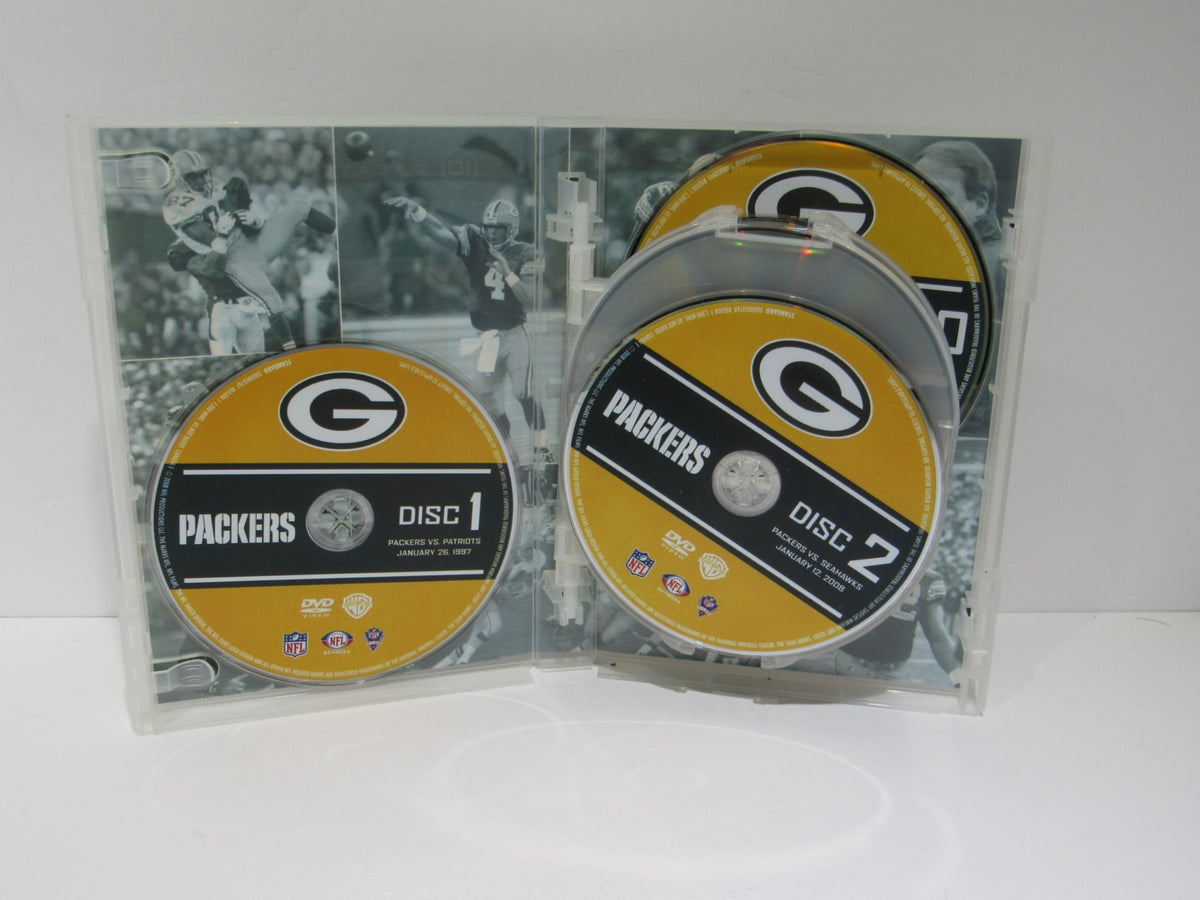 Inside view of NFL Greatest Games Series: Green Bay Packers Greatest Games DVD case showing discs 1 and 2.