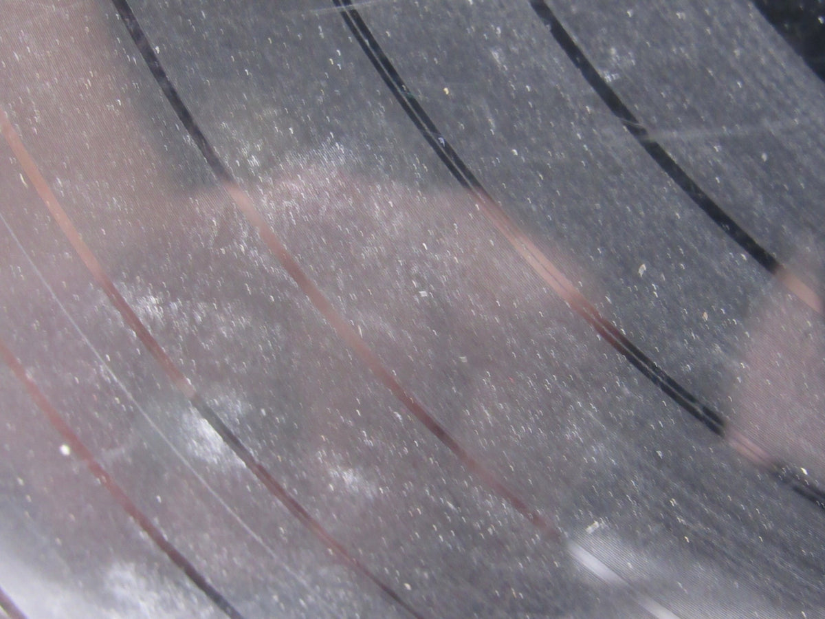 Close-up view of a vinyl record showing surface dust and scratches from The Beatles: Meet The Beatles US Mono Capitol Records LP T 2047 Grade: G.