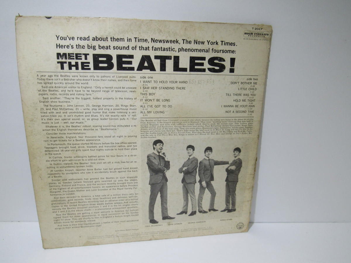 Back cover of The Beatles: Meet The Beatles US Mono Capitol Records LP T 2047 displaying information and track listings.