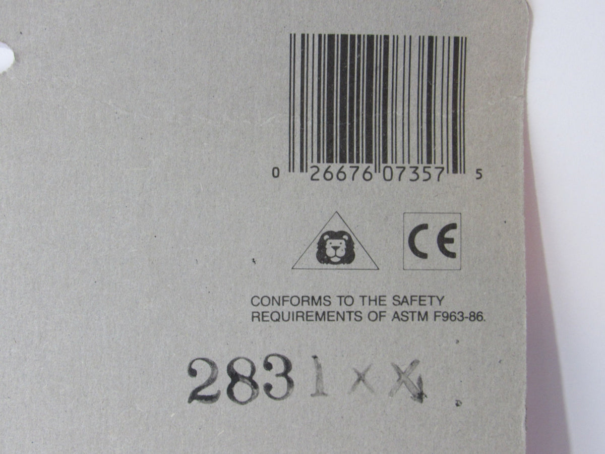 Back view of the VTG Mattel BARBIE Pose Me Pretty Doll Stands packaging showing barcode and safety compliance information.