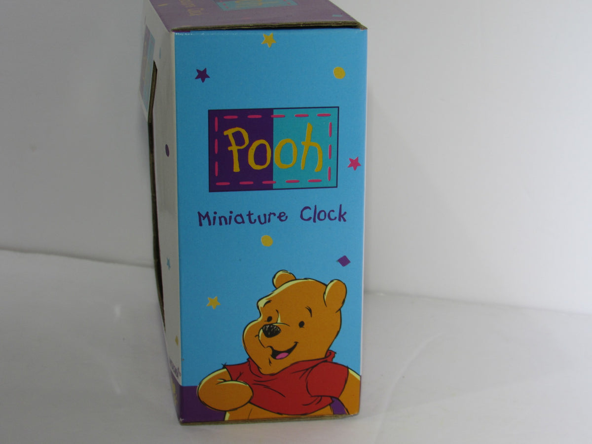 Side view of Fantasma Walt Disney Winnie The Pooh Miniature Desk Office Clock box showcasing colorful design and playful Pooh illustration.