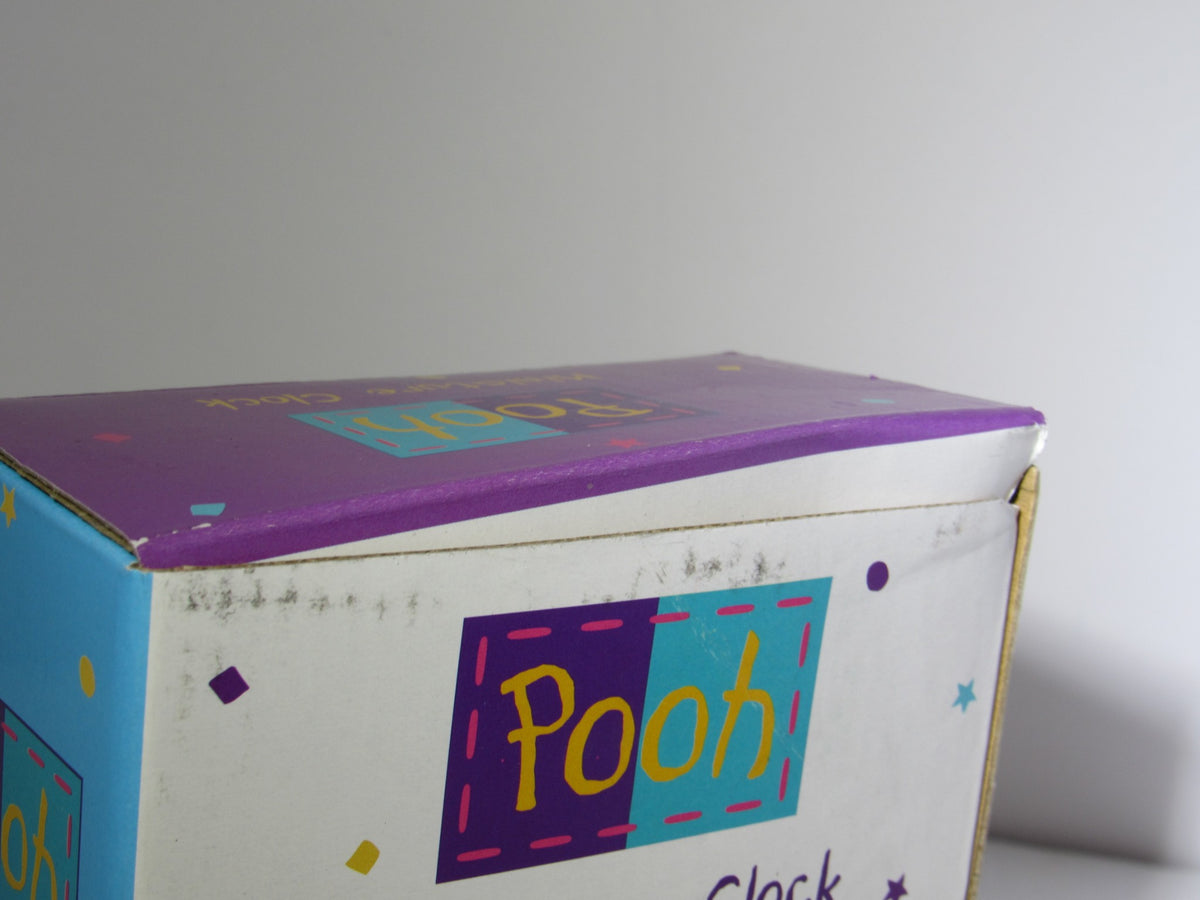 Close-up of the top of the Fantasma Walt Disney Winnie The Pooh Miniature Desk Office Clock box, showing the whimsical design elements.