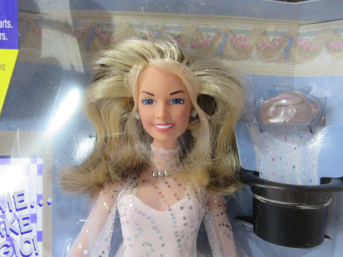 Close-up of the face of the 1997 VTG Kenner Sabrina The Teenage Witch doll inside the package, displaying the doll's features and accessories.