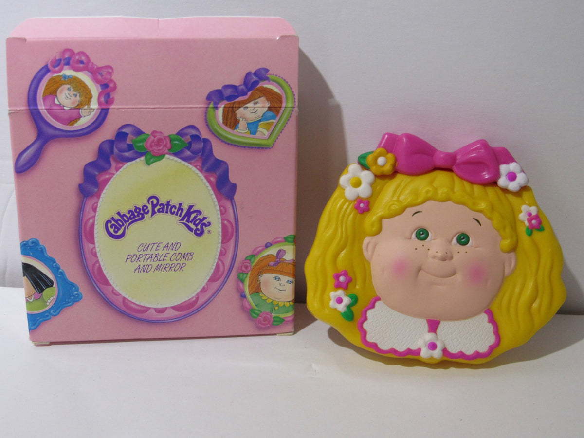 1995 Rare Avon Cabbage Patch Kids Portable Comb and Mirror Compact NIB with colorful packaging and a smiling character design.