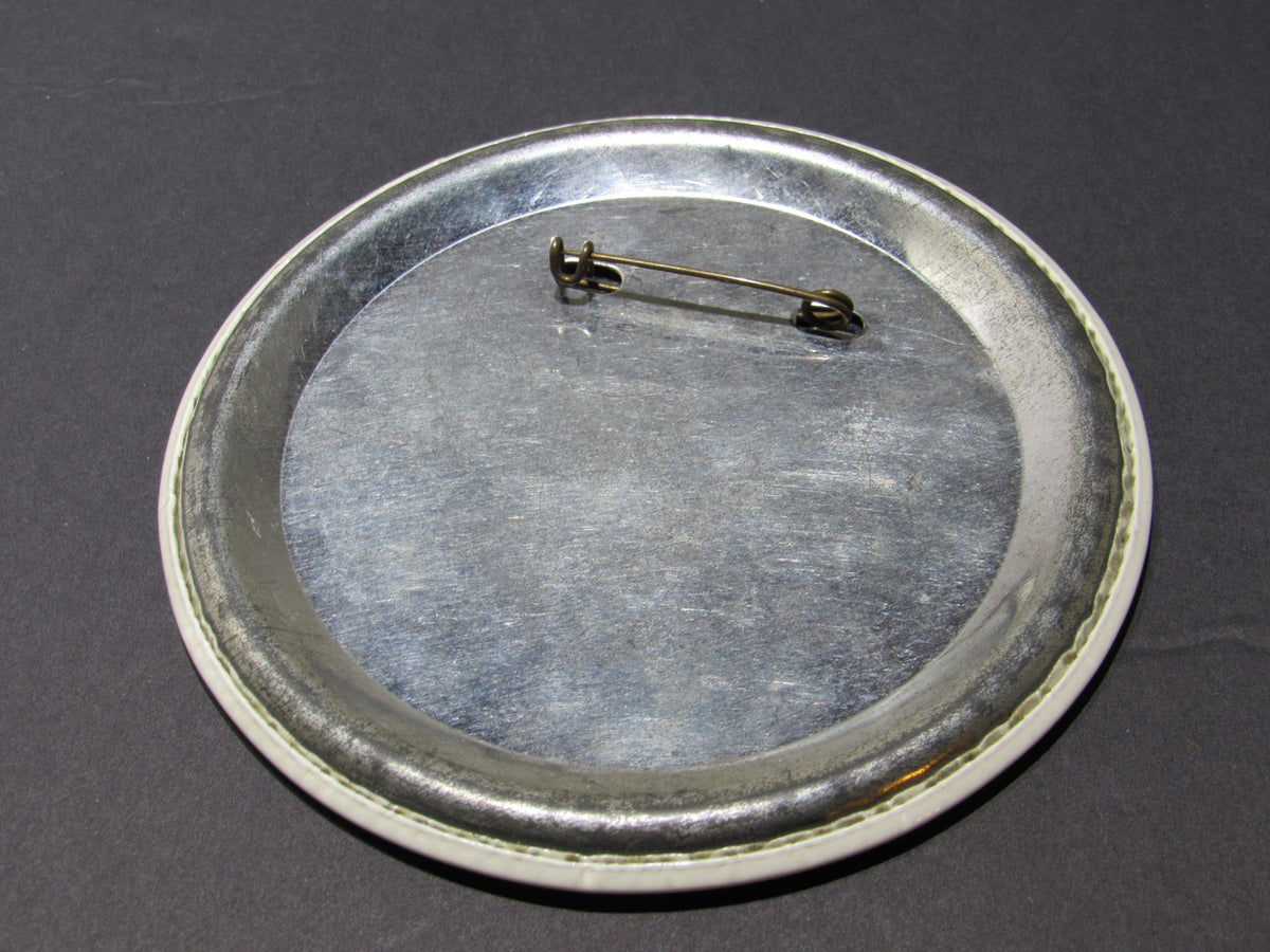 Back view of the 1970 Vintage Prospect Heights Senior High Button Pinback, displaying the metal backing with a pin clasp for attachment.
