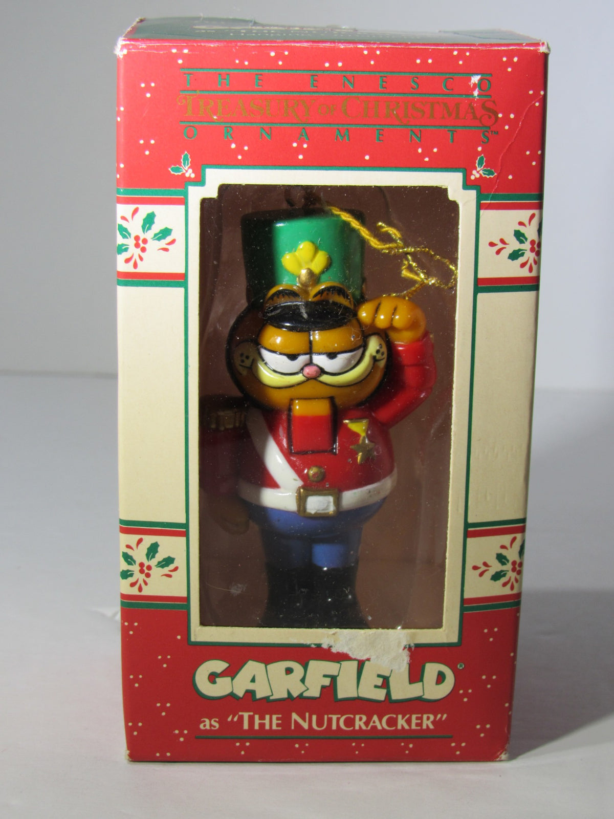 1978 VTG Enesco Treasury of Christmas Ornament featuring Garfield as The Nutcracker in original packaging, showcasing the front view and design details.