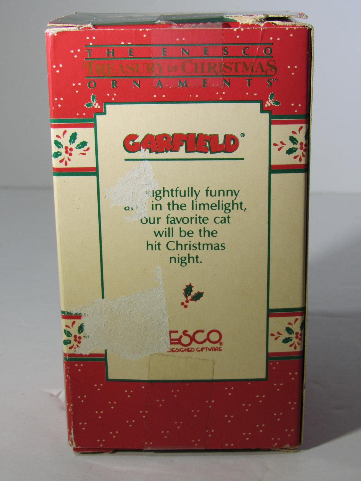 Back view of the 1978 VTG Enesco Treasury of Christmas Ornament depicting Garfield as The Nutcracker, with a description of its charming character.