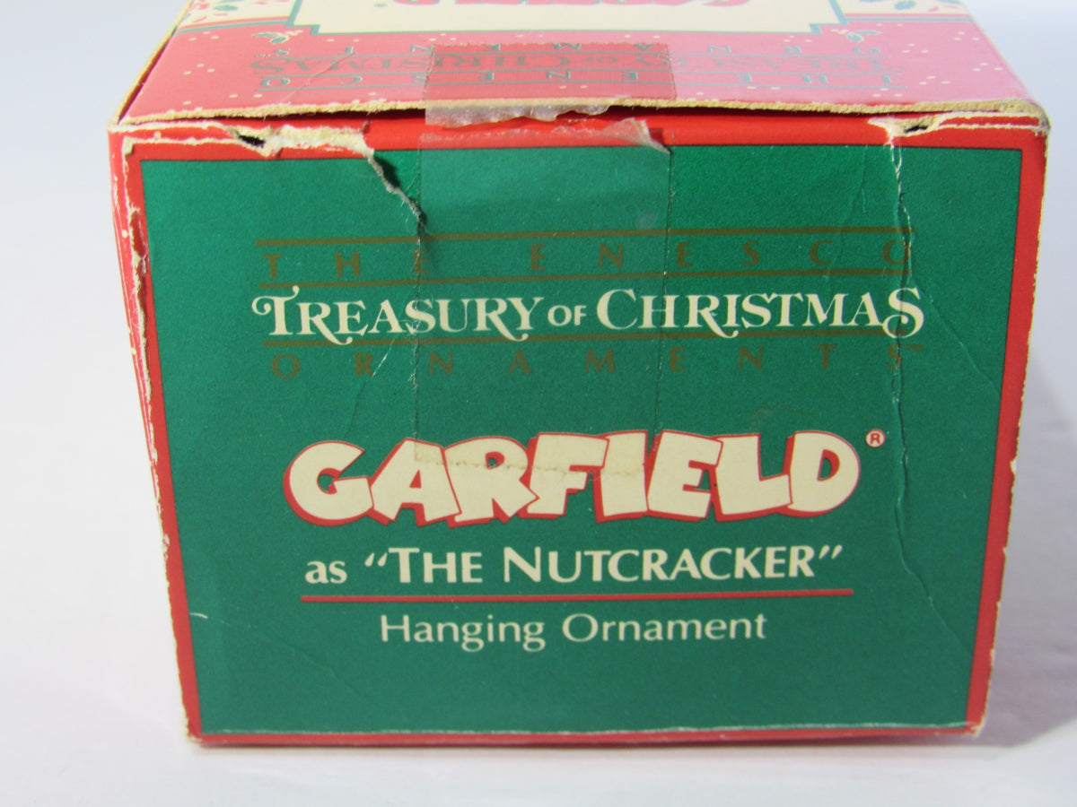 Top view of the 1978 VTG Enesco Treasury of Christmas Ornament showcasing Garfield as The Nutcracker, featuring ornament specifications and branding.