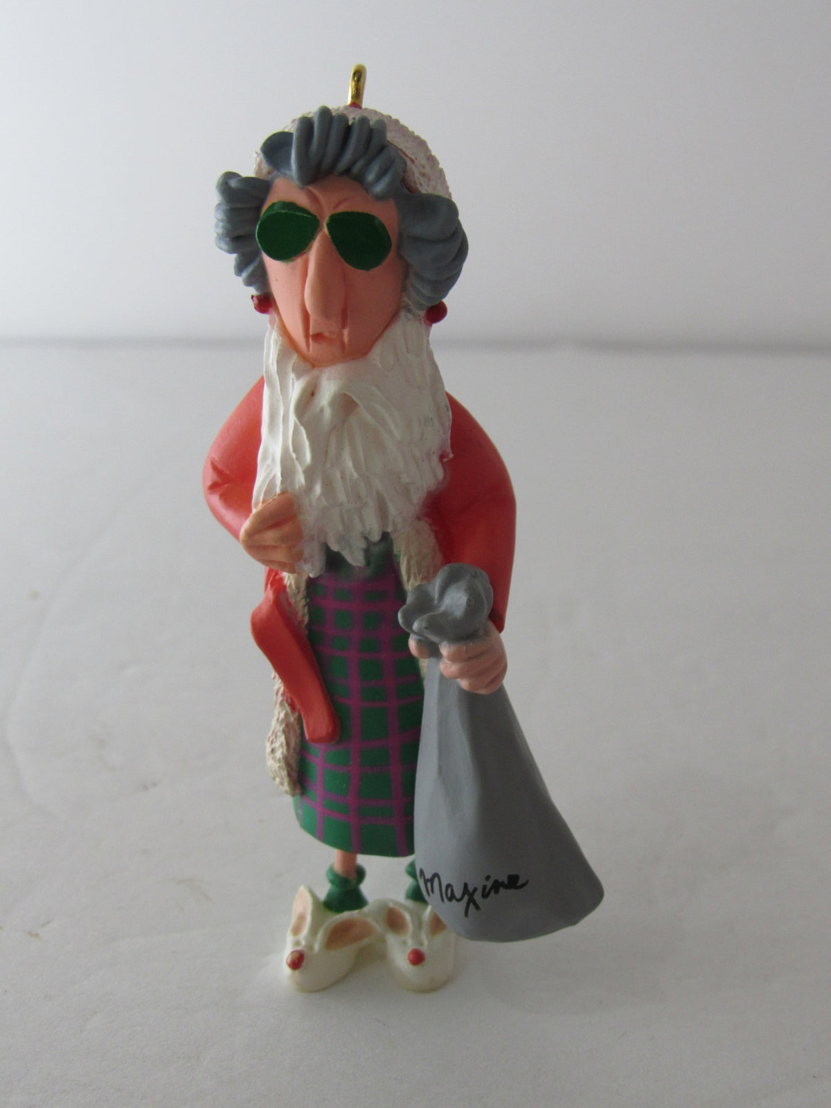 Hallmark Keepsake Ornaments Lot of 2 Maxine 1993 & Maxine on Thin Ice 1999 NIB - A whimsical Maxine ornament wearing sunglasses and a Santa-inspired outfit, holding a sack, ideal for collectors.