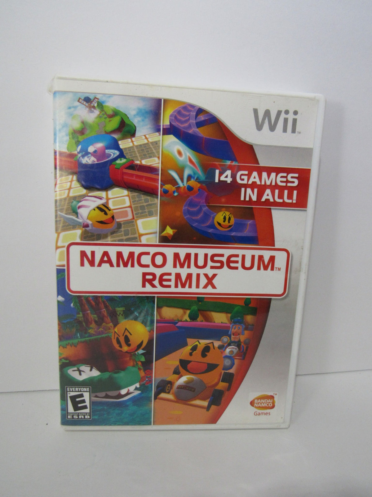 2007 Namco Museum Remix Nintendo Wii game cover showcasing vibrant graphics and featuring the text '14 Games in All!'.