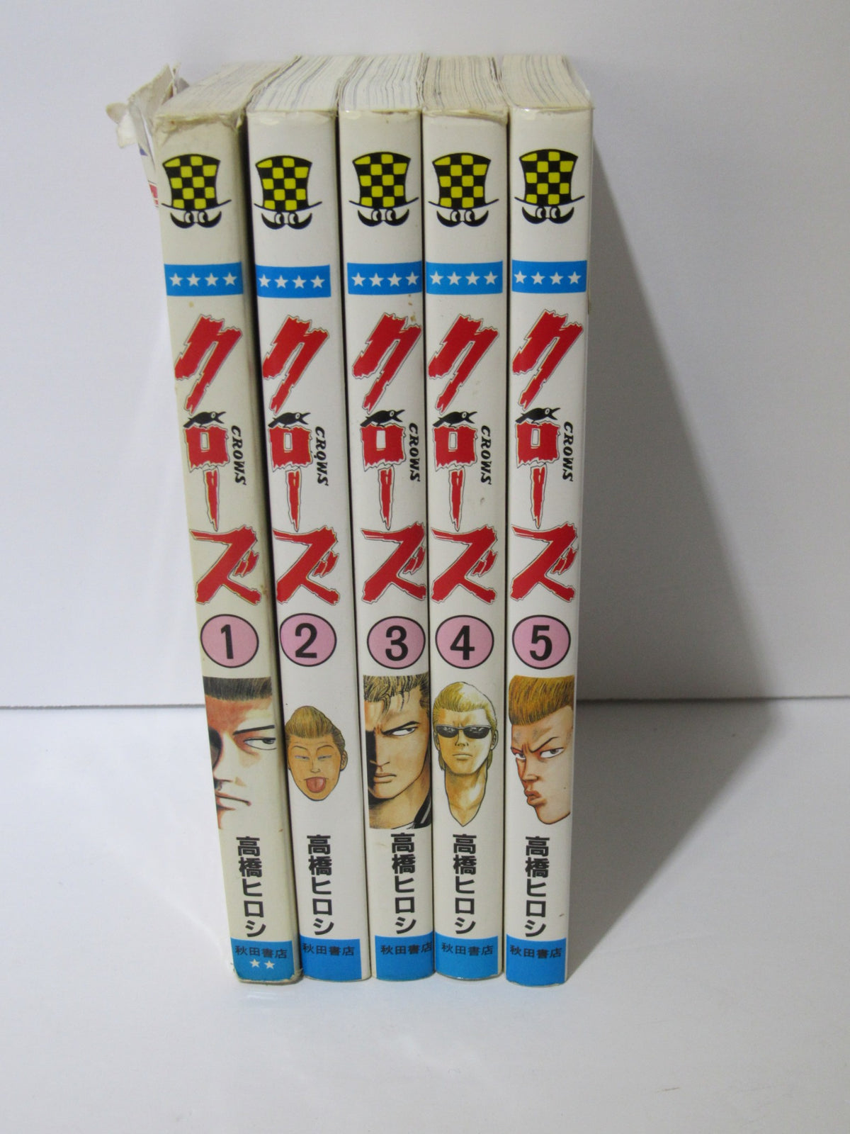 1991 Shonen Champion Comics Crows Manga Vol. 1-5 arranged vertically, highlighting the iconic character art and distinct numbering on each volume.