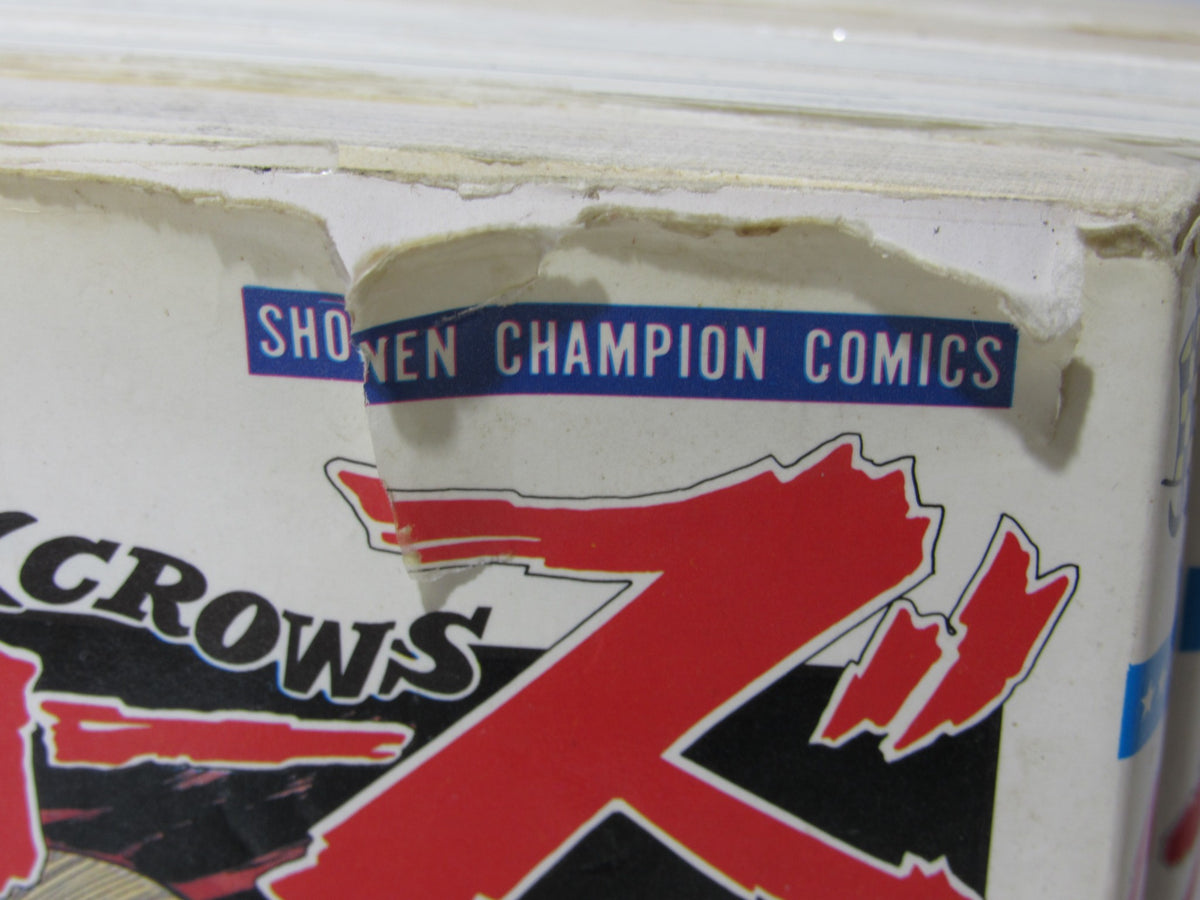 Close-up of the damaged cover of '1991 Shonen Champion Comics Crows Manga Vol. 1-5', showing the title 'Shonen Champion Comics' with visible wear.