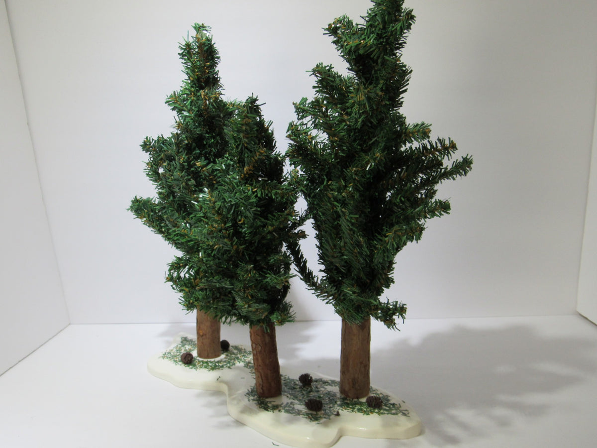 View of the Vintage Department 56 Village Spruce Tree Forest with Wooden Base #5248-5 showcasing two tall green spruce trees and surrounding ground details.