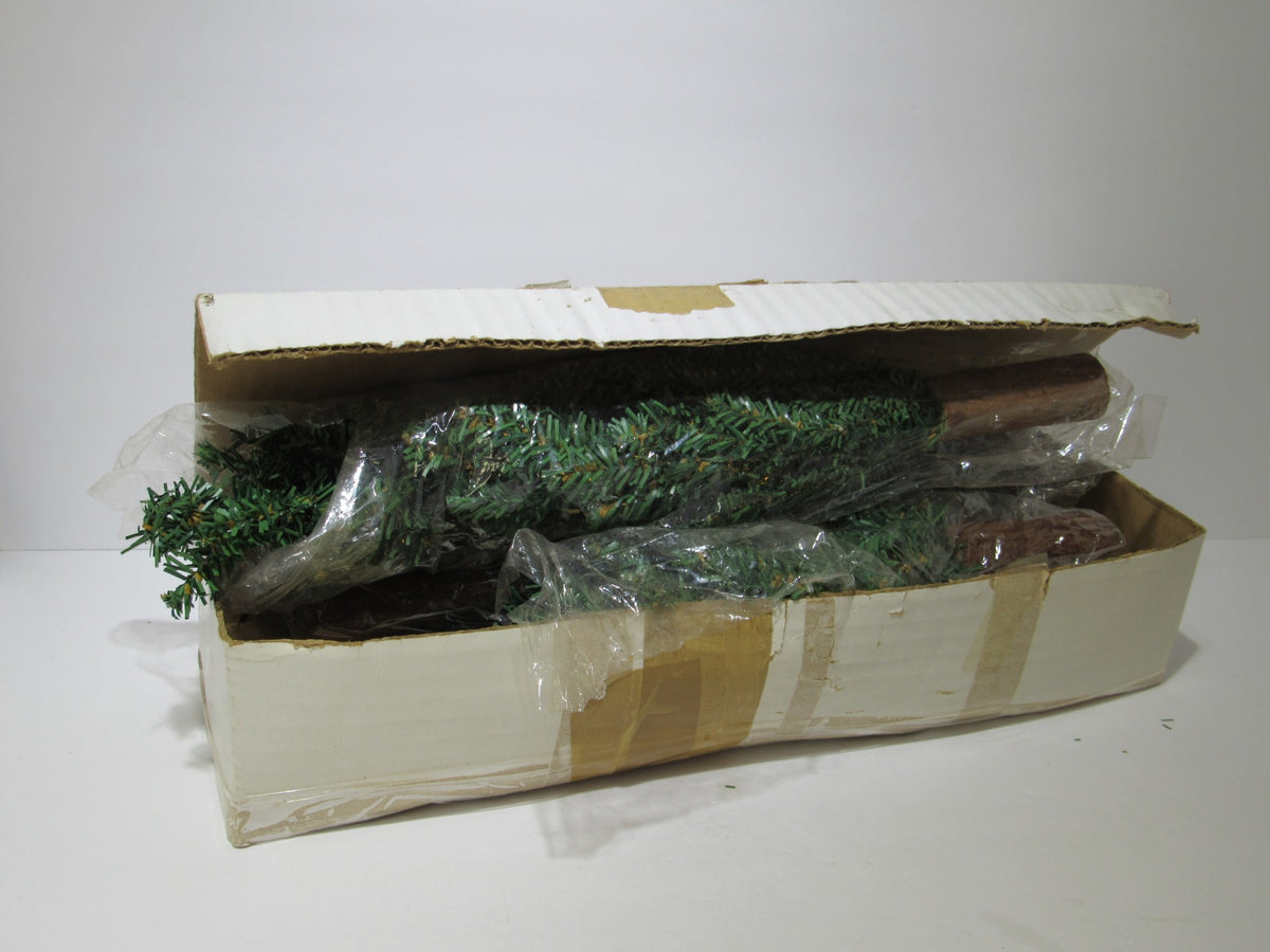 Vintage packaging for Department 56 Village Spruce Tree Forest with Wooden Base #5248-5, featuring protective plastic around the trees.