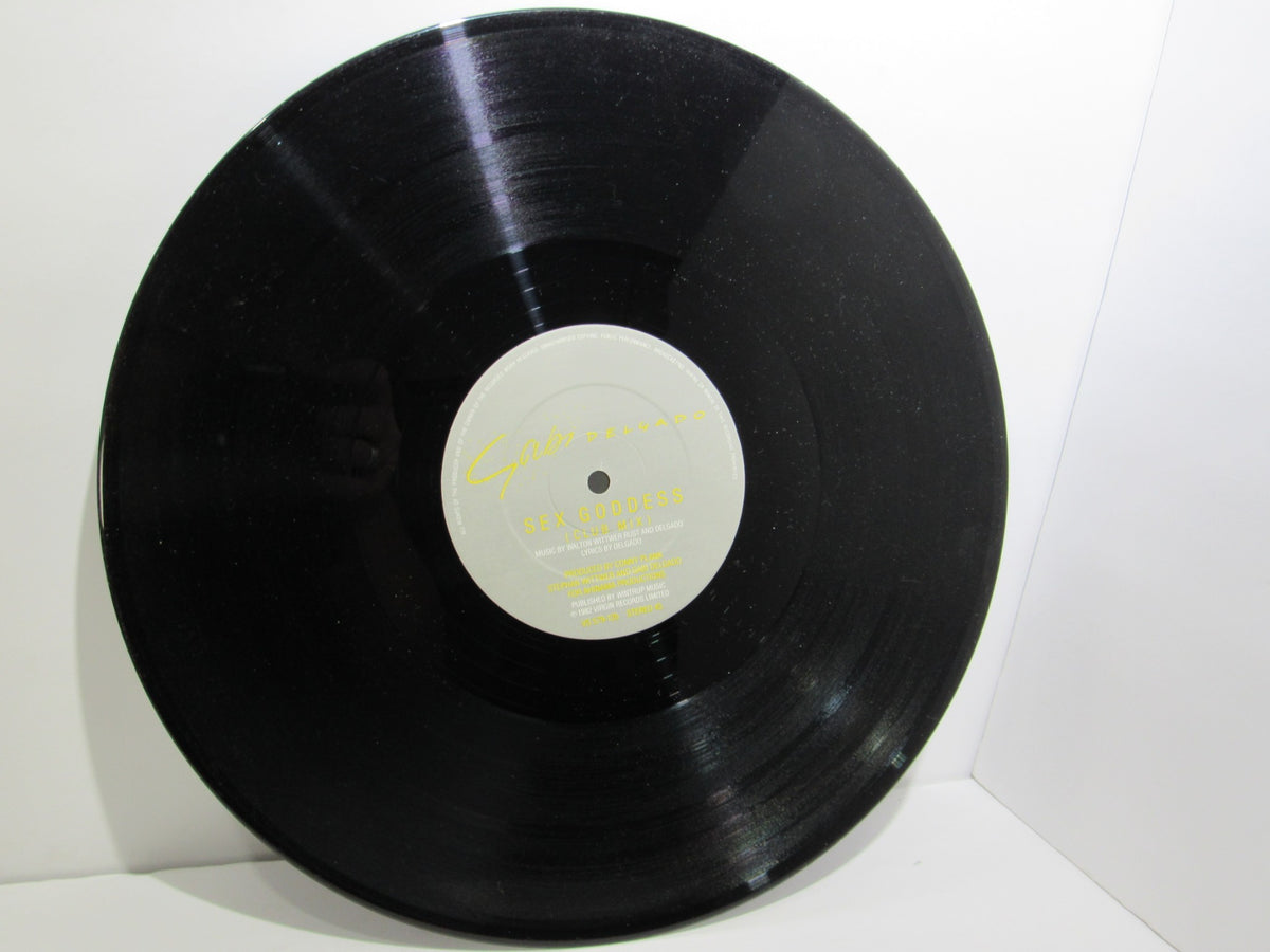 Close-up of the vinyl record for Gabi Delgado: History Of A Kiss Virgin VS 579-12, highlighting its glossy surface and label design.