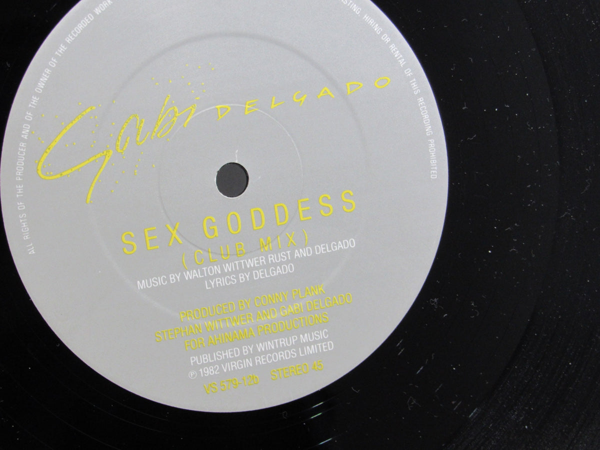 Detailed view of the label on the vinyl record, Gabi Delgado: History Of A Kiss Virgin VS 579-12, featuring the song title 'Sex Goddess' and production credits.