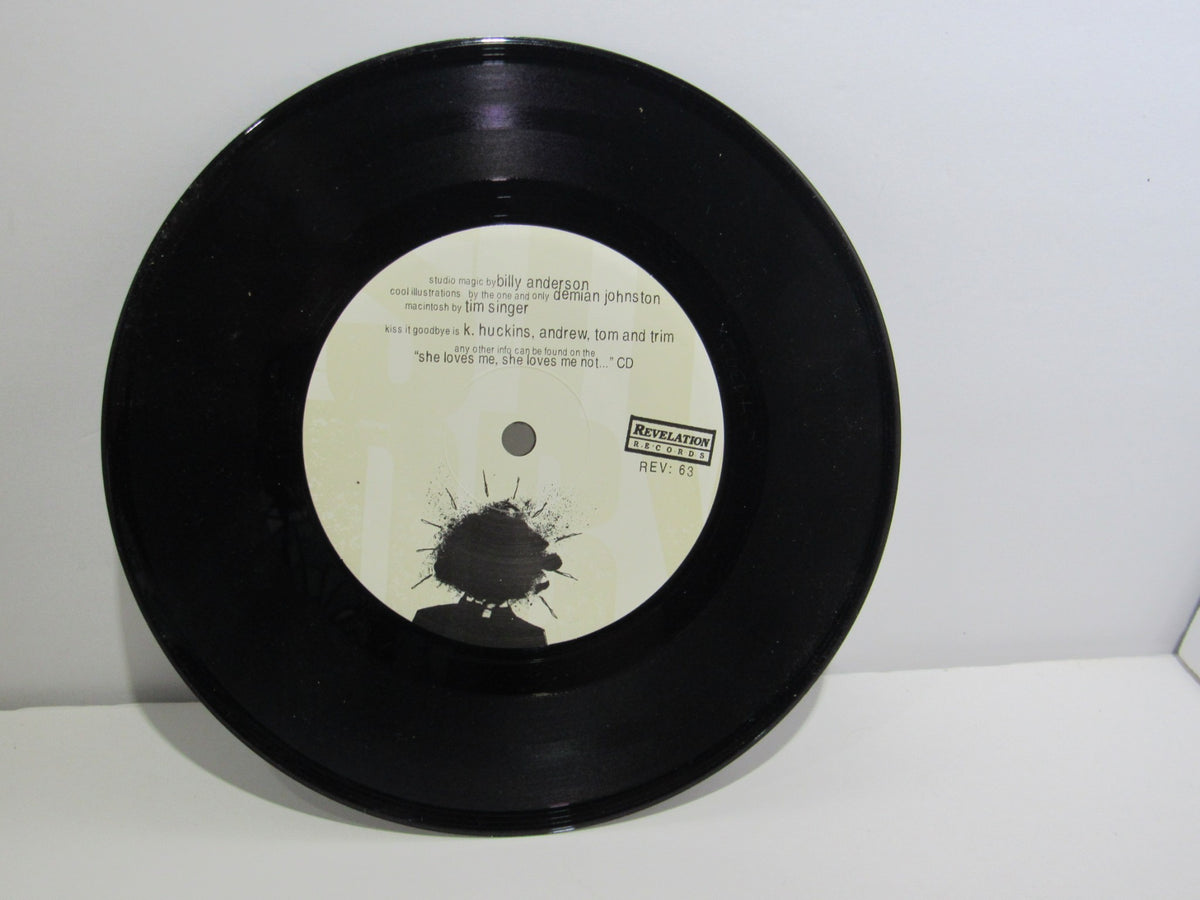 The vinyl record of Kiss It Goodbye: Target Practice 7" single by Revelation Records, showcasing the label and credits.