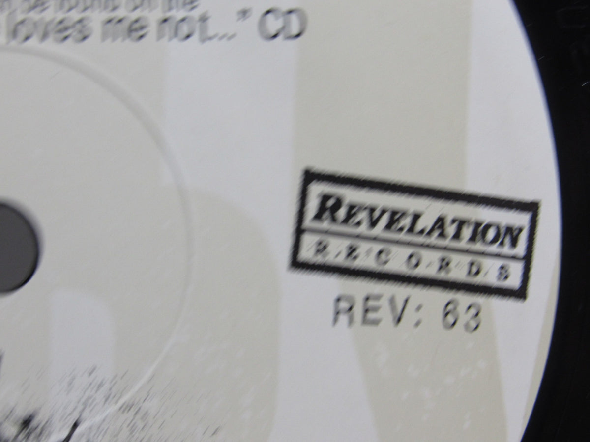 Detail shot of the Revelation Records logo on the Kiss It Goodbye: Target Practice 7" single vinyl, indicating the release number.