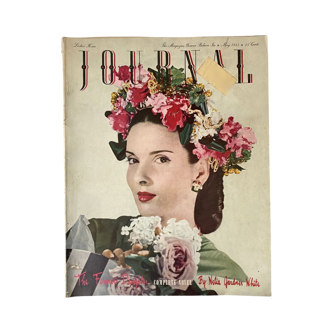Ladies' Home Journal Magazine May 1945 cover featuring a woman adorned with flowers, representing the captivating story 'The Farmer's Daughter.' This vintage magazine captures the essence of mid-20th century American culture.