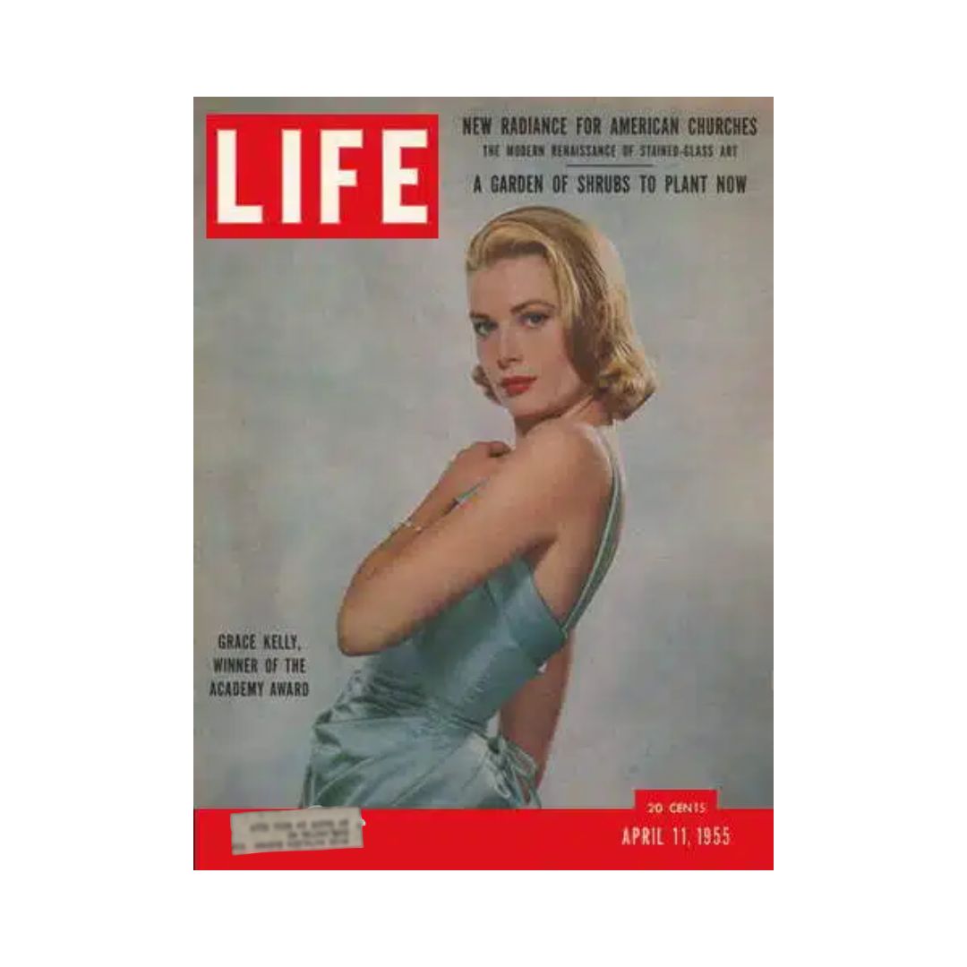 Cover of VTG Life Magazine dated April 11, 1955, featuring Grace Kelly, Academy Award Winner, depicted in an elegant light blue dress. The magazine highlights topics including modern stained-glass art and garden planting tips.