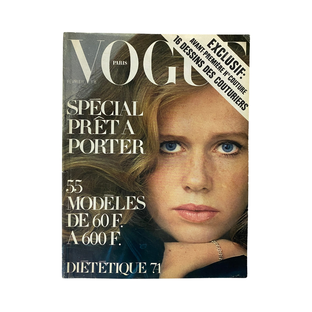 Cover of Vogue Paris Magazine February 1971 featuring a striking model with long hair, highlighted text promoting a special prêt-à-porter section, showcasing the magazine's vintage fashion insights.