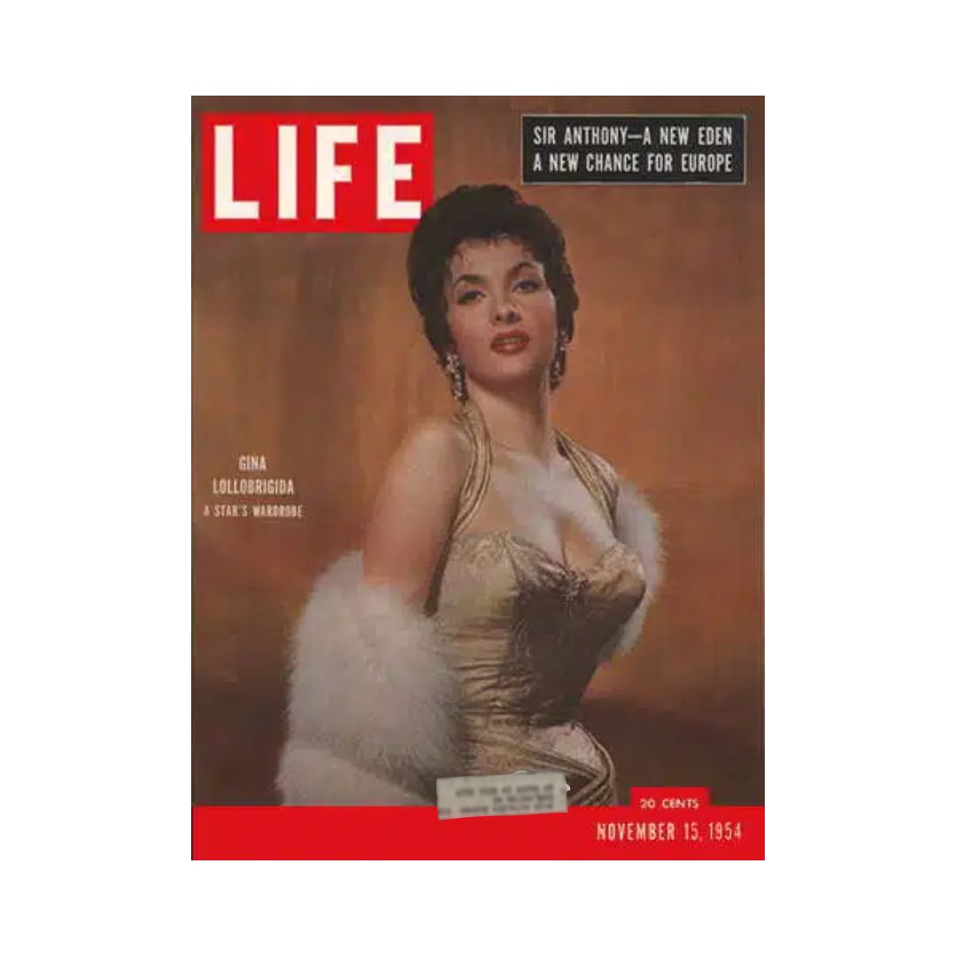 Cover of the Life Magazine dated November 15, 1954, featuring Gina Lollobrigida dressed elegantly in a sparkling gown with soft fur accents, encapsulating the glamour of 1950s vintage fashion.