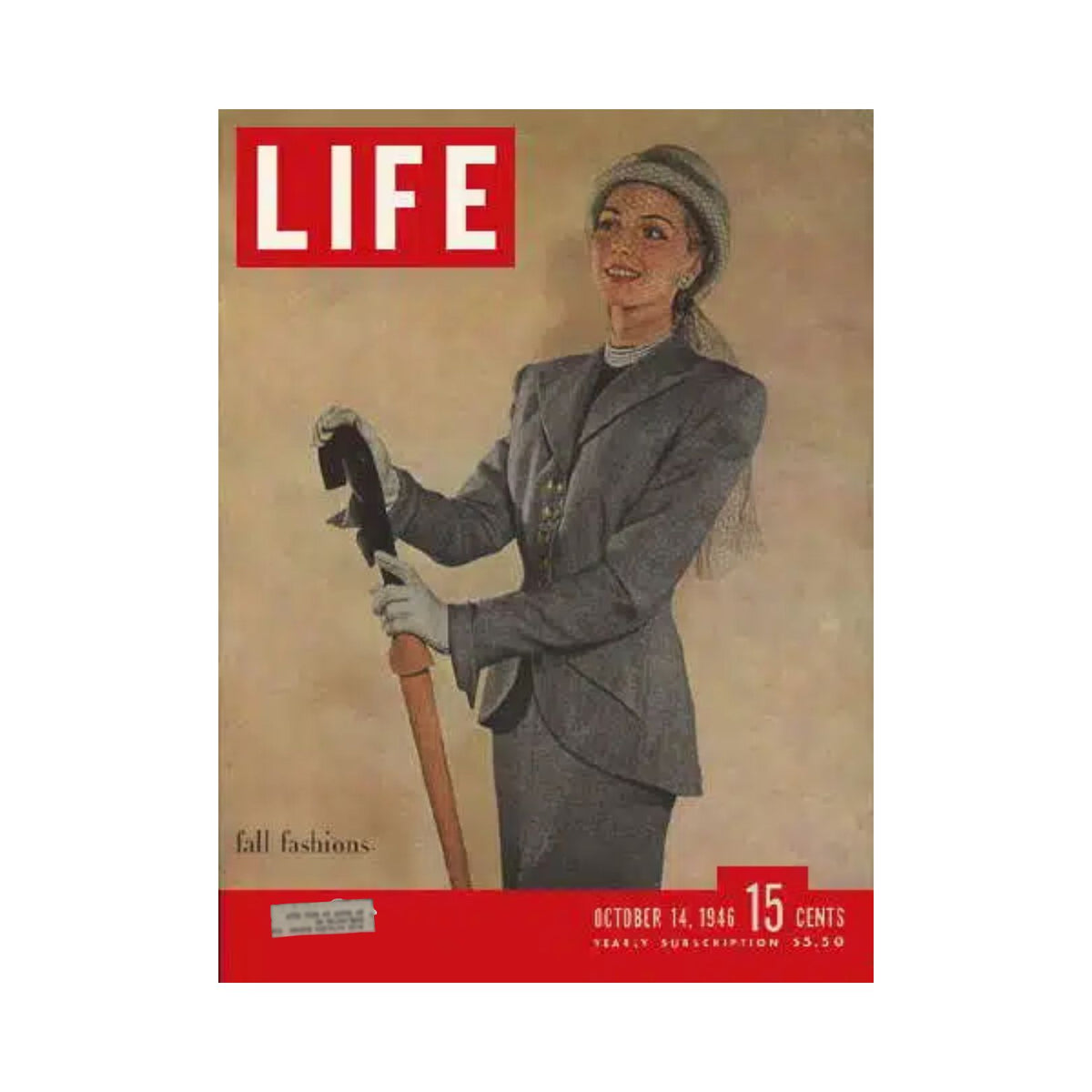 Cover of VTG Life Magazine from October 14, 1946, showcasing fall fashion featuring a stylish woman in a tailored outfit holding an umbrella.