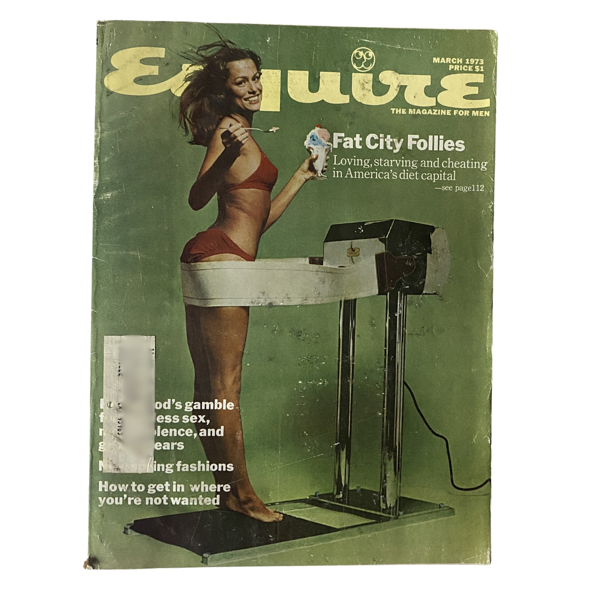 Esquire Magazine March 1973 cover featuring the article 'Fat City Follies,' depicting a woman in a swimsuit standing on a dieting scale, representing America's dieting culture.