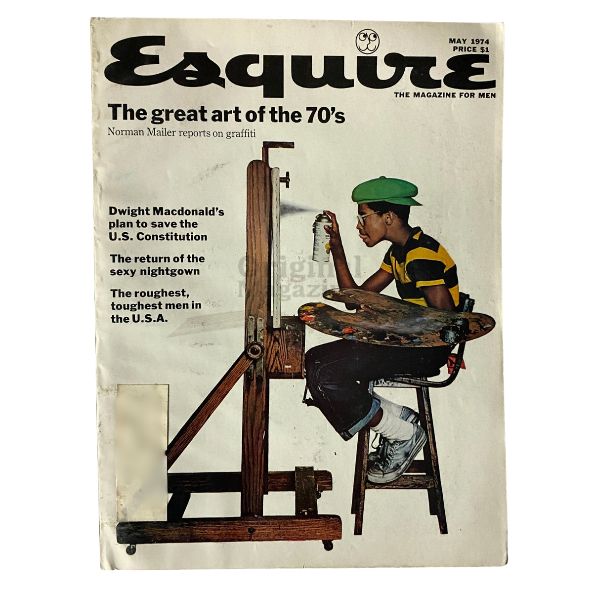 Cover of Esquire Magazine May 1974 featuring a report by Norman Mailer on graffiti, showcasing a young boy painting with spray cans, highlighting the great art of the 1970s.