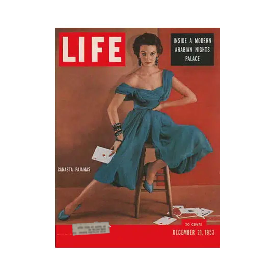 VTG Life Magazine December 21, 1953 featuring Canasta Pajamas fashion on the cover, showcasing a model in a stylish dress against a vibrant background, with playing cards scattered around.