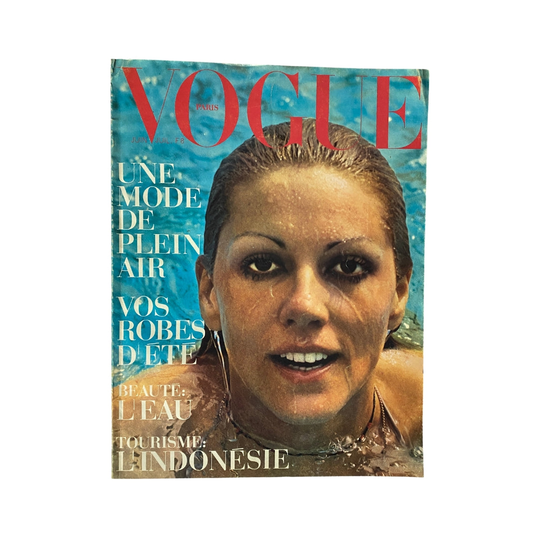 Cover of Vogue Paris Magazine June - July 1971 featuring Kiki Caron, showcasing vintage fashion and culture with a swimming theme.