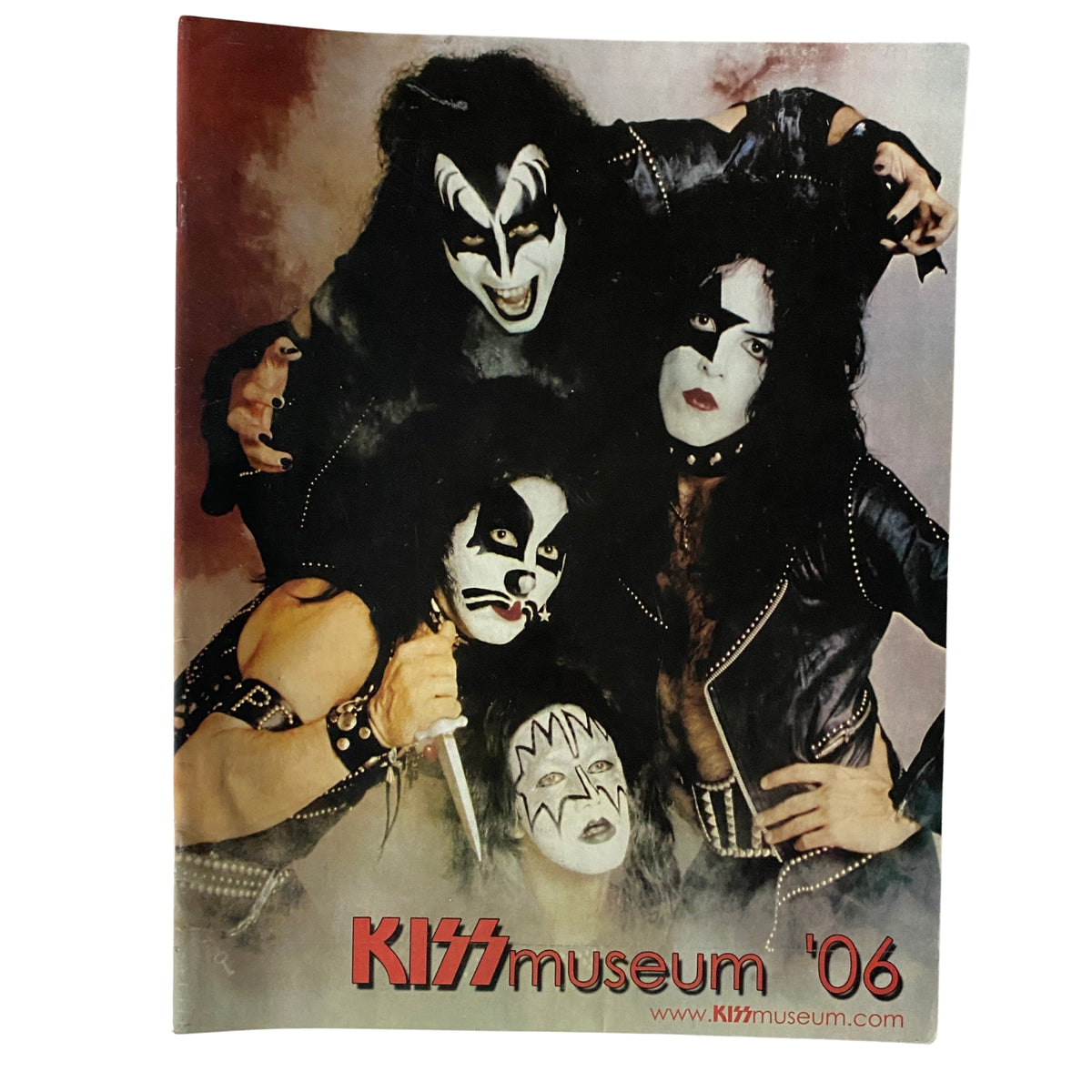 KISS Museum.com Catalog 2006 cover featuring the iconic rock band KISS in makeup and leather outfits, showcasing their unique style and legacy.