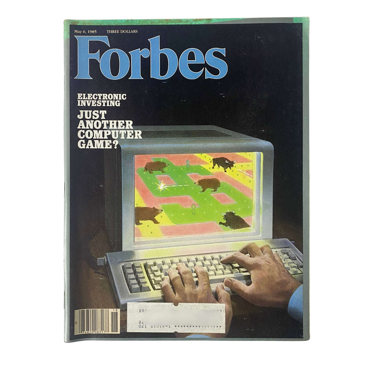 Forbes Magazine May 6, 1985 cover featuring the article 'Electronic Investing: Just Another Computer Game?' showcasing a computer screen displaying a game-like investing scenario with hands typing on a keyboard.