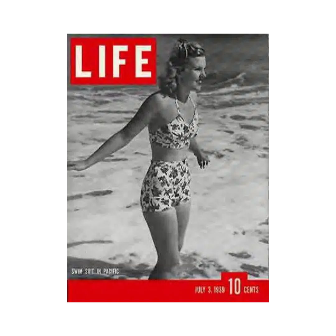 Cover of VTG Life Magazine, July 3, 1939, featuring a woman in a floral swimsuit walking along the beach, representing 1930s summer fashion.