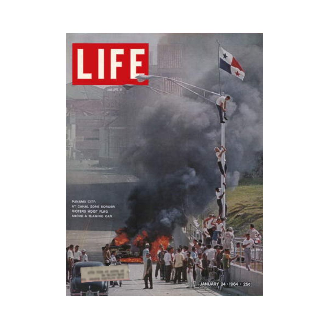 Life Magazine cover from January 24, 1964, depicting riots at the Panama Canal Zone with rioters hoisting the Panamanian flag above a burning car, illustrating a pivotal moment in U.S.-Panama relations.