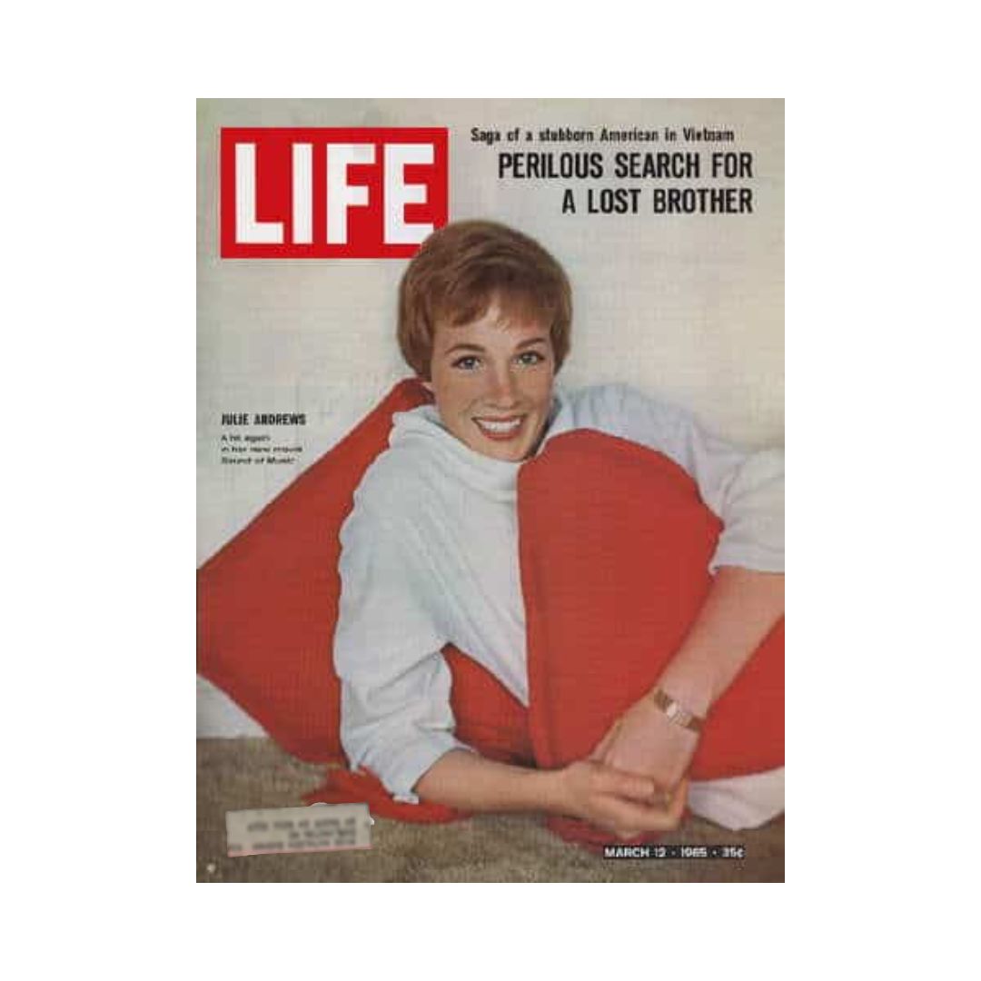 Front cover of the vintage Life Magazine from March 12, 1965, featuring Julie Andrews, celebrating her role in The Sound of Music. The cover showcases her with a bright smile, adorned in a white sweater with red pillows, capturing a nostalgic moment from the 1960s.